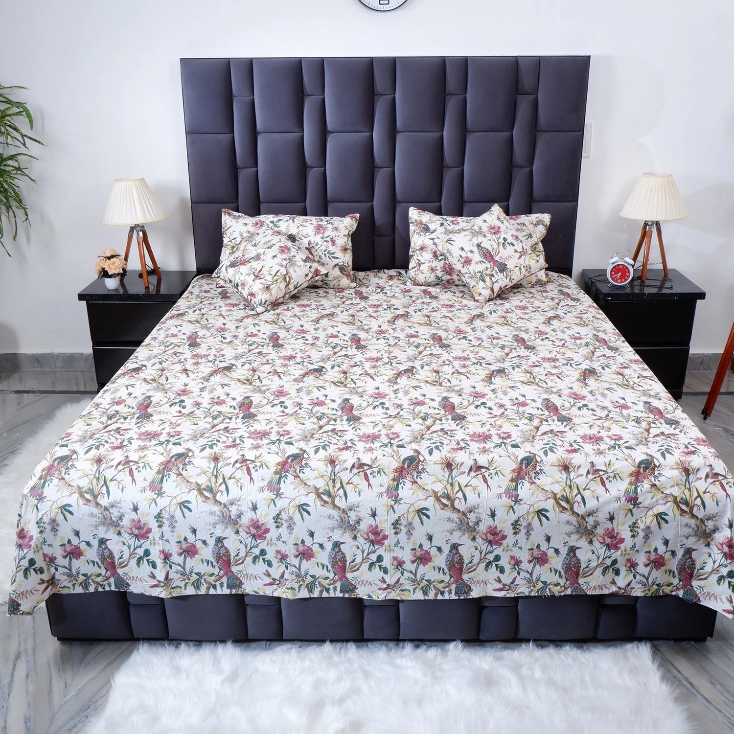 Jaipur cotton bed sheet featuring floral design with bird motifs on a stylish bed